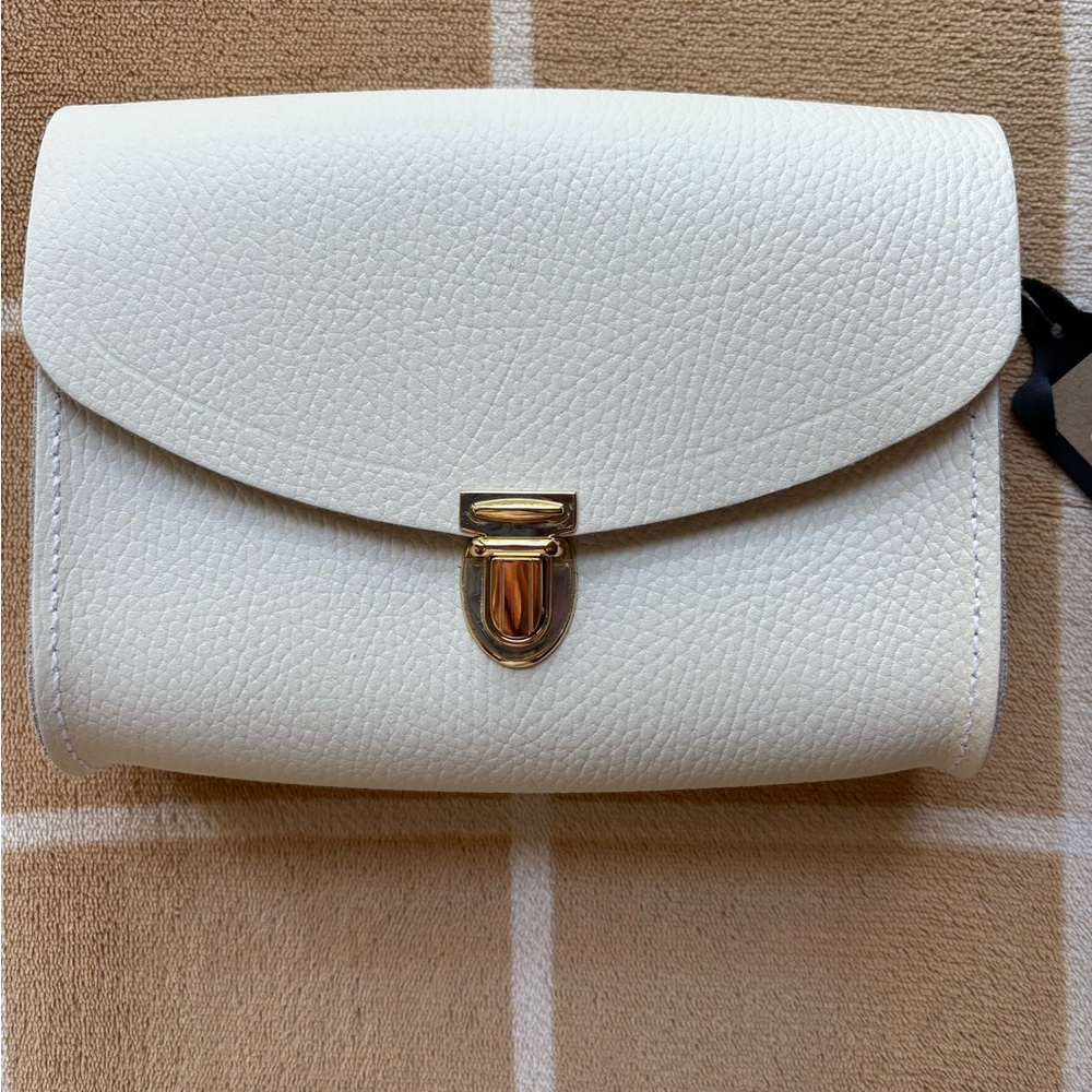Cambridge Satchel Company small push lock purse in cream pebbled leather.